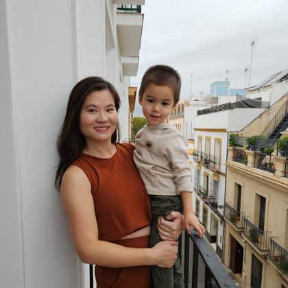 Cai holding her son
