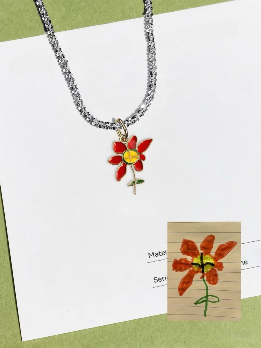 Red flower drawing as an enamel pendant