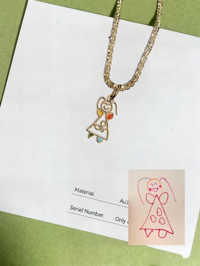Simple girl drawing as an outline pendant with a few colored dots