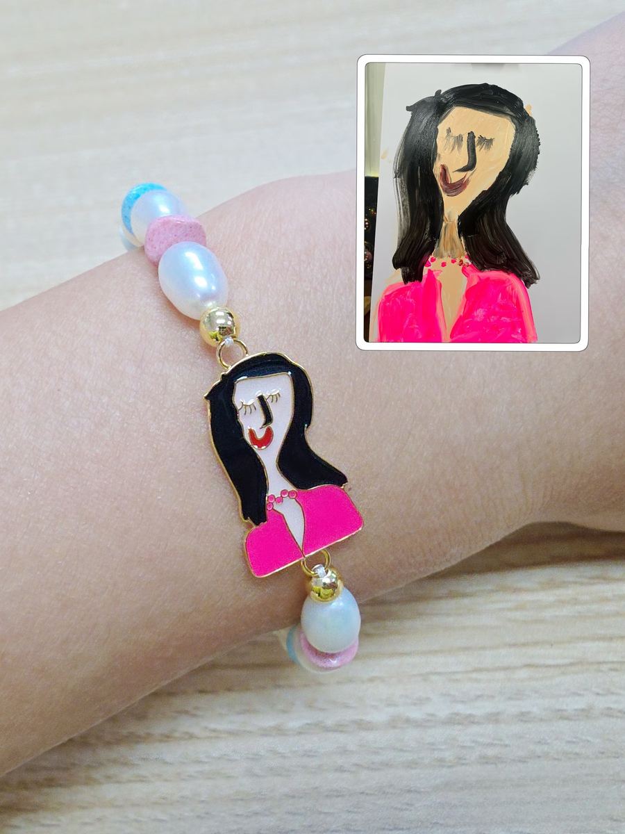 Painting of mom as a charm on a pearl bracelet